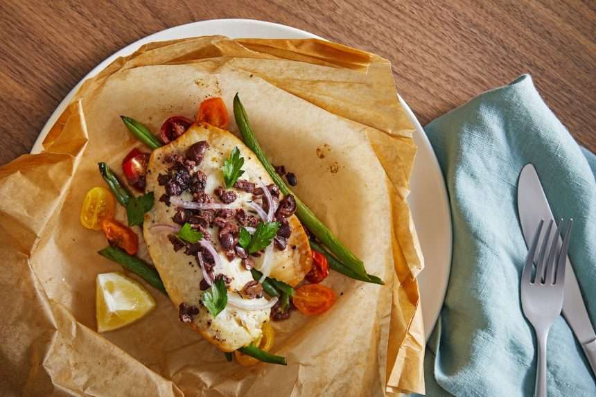 Fish And Vegetables Wrapped In Parchment Paper Are Very (and)