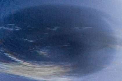 Neptune's Mysterious Dark Vortex Observed From Earth For The First