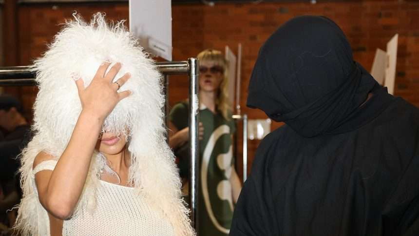 Kanye West's 'wife' Wears Giant White Wig, Swimsuit And Trademark
