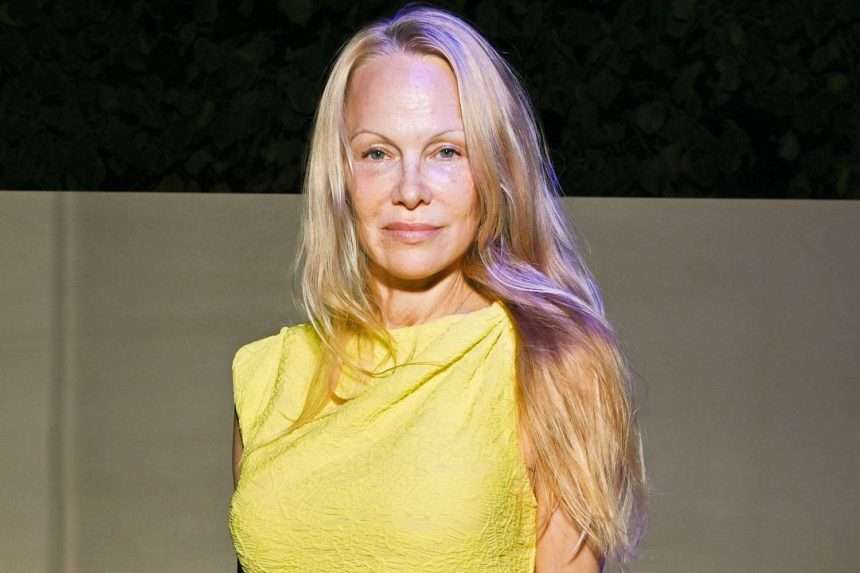 Pamela Anderson Stunned In Yellow Dress During Paris Fashion Week