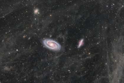 Daily Telescope: Two Large Galaxies Swim In A Sea Of