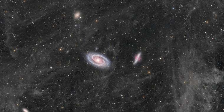 Daily Telescope: Two Large Galaxies Swim In A Sea Of